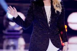 Kevin Winter/Getty Images Entertainment/Getty Images Demi Lovato pairs a textured velvet blazer with black leather pants for an edgy look.
