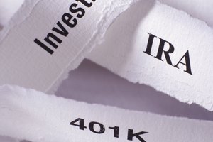 Strips of paper with Investments, IRA, 401K and Retirement inscriptions