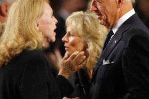 Pool/Getty Images News/Getty Images Vice President Biden chats with Sen. Edward Kennedy's ex-wife, Joan, during the Mass for the senator in Washington, D.C.