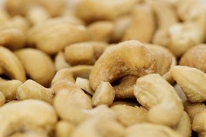 Stockbyte/Stockbyte/Getty Images Cashews are always sold without shells, so you won't have a problem choosing the largest, meatiest ones available.