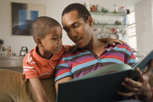 Father and son reading book