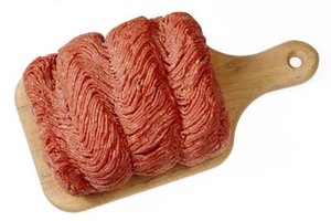 Jupiterimages/Comstock/Getty Images Ground beef is the foundation for American versions of shepherd's pie, though purists across the pond might insist on minced lamb or mutton.