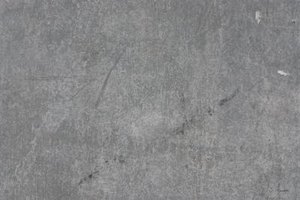 Hemera Technologies/AbleStock.com/Getty Images A "concrete detail" essay about concrete will likely describe the common gray color as an important detail.