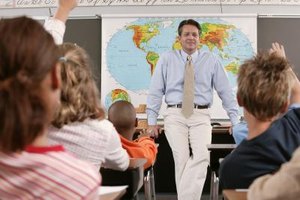 Comstock Images/Comstock/Getty Images Fifth-graders should be able to use coordinates of latitude and longitude to locate cities on a map of the United States.