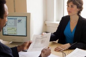 Creatas Images/Creatas/Getty Images If your boss wants to make extensive changes in your job description, offer to draft a new one for his approval.