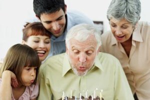 George Doyle/Stockbyte/Getty Images Planning and family tradition can help you create a memorable birthday dinner for your father-in-law.