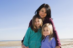 Mother and daughters at a beach