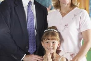 Brand X Pictures/Brand X Pictures/Getty Images A family's joy at a child's First Holy Communion can be shared by friends, family members and the congregation.