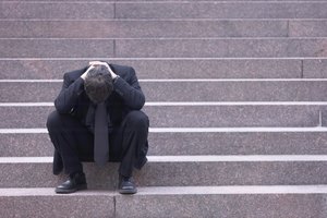 Stressed businessman on staircase