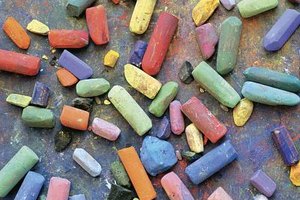 Liquidlibrary/liquidlibrary/Getty Images If your chalk-stained brick is near plants that need watering, turn on the sprinkler and let the water hit the bricks and your plants.
