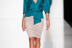 Andreas Rentz/Getty Images Entertainment/Getty Images A model walking in a Julia Dalkian fashion show wears her beige skirt with a brightly colored blouse.