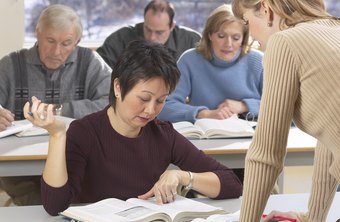 Female sitting in classroom training program reading materials