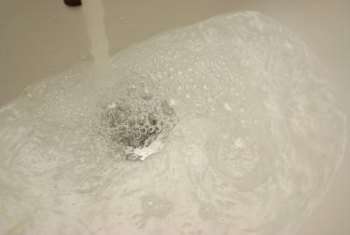 What causes bubbles to form in a toilet?