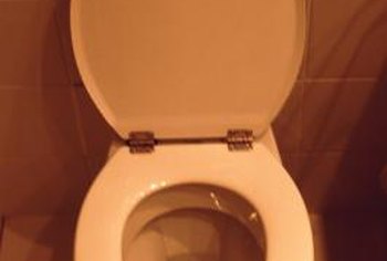 What causes bubbles to form in a toilet?