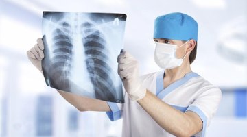 Medical student looking at X-ray of lungs