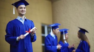 Graduated student holding degree in hand