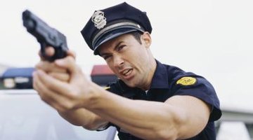Police officer holding up gun