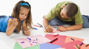 Use construction paper, glue and crayons to create easy glyphs.