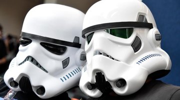 Close-up of students wearing Star Wars helmets