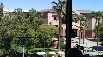 Cypress Hall, one of nineteen[23] residence halls, as viewed from the second floor of student union  GCU campus police officer and police car of GCU's campus police department