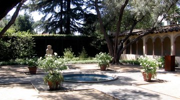 A view of the central pool, northern arcade and sculpture in the Margaret Fowler Garden at Scripps College.