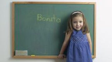 "The girl wrote a word on the chalkboard" contains both a transitive verb and prepositional phrase.