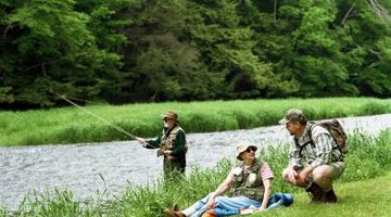 To describe three men travelling and fishing, you need a compound subject with a compound predicate.
