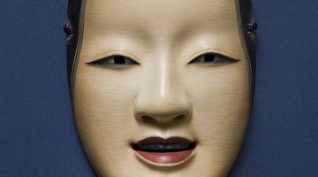 This modern Noh mask from Japan portrays the face of a beautiful young woman.