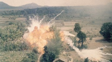 A napalm bomb explodes during a strike south of Saigon during the Vietnam War
