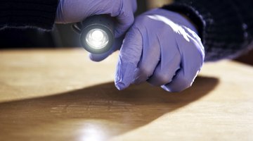 A forensic scientist collects evidence from a crime scene.