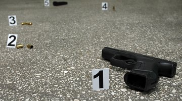 Guns and bullets at the scene of a crime.