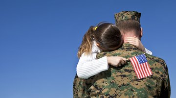 Young child hugging veteran father