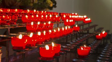 Close-up of red candle set-up in church.