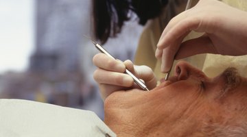 Dental hygienists assist in routine procedures.
