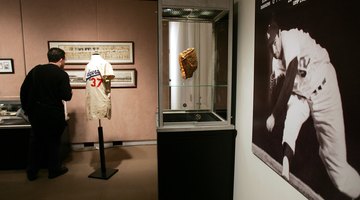 A fan looks at historic baseball items in a display in New York.