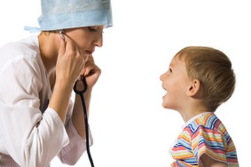 A doctor examines a boy A doctor examines a boy
