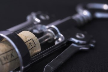 Sommeliers work along with restaurant managers to choose the best wines to pair with the night's cuisine. Sommeliers work along with restaurant managers to choose the best wines to pair with the night's cuisine.