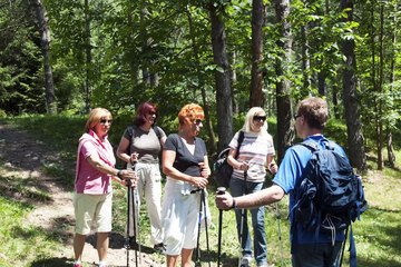 Activities Director leading group hike of four women Activities Director leading group hike of four women