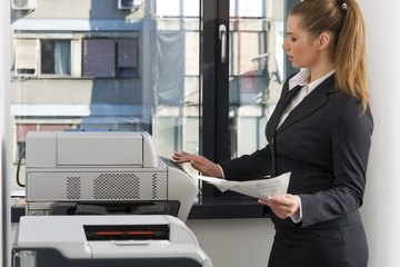 Secretary using printer Secretary using printer