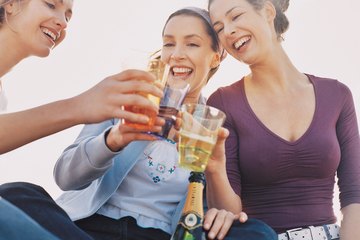 Women celebrating with a toast of champagne. Women celebrating with a toast of champagne.