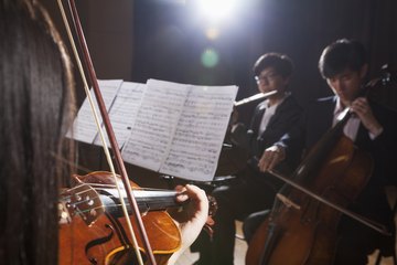 Classical musicians performing on stage. Classical musicians performing on stage.