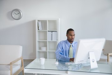 Man typing on computer Man typing on computer