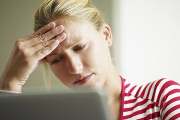 Woman feeling stressed at office Woman feeling stressed at office