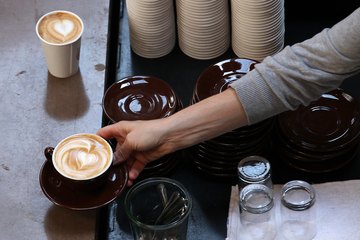 Barista serving drink with Barista serving drink with