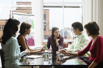 Five business people in a meeting Five business people in a meeting