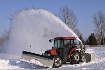 Small vehicle plowing snow Small vehicle plowing snow