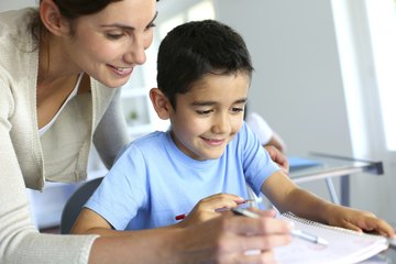 Teacher helping student with homework Teacher helping student with homework