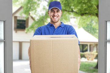 Delivery man holding a box Delivery man holding a box
