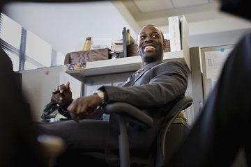 Business man smiling in the office Business man smiling in the office