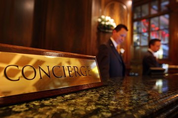 Two concierges man the front desk Two concierges man the front desk
